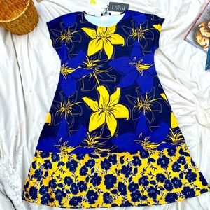 Cute flower dress. Knee length.Flattering fit and style.Blue with yellow flowers